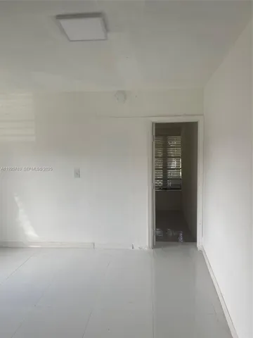 a view of an empty room and fire place