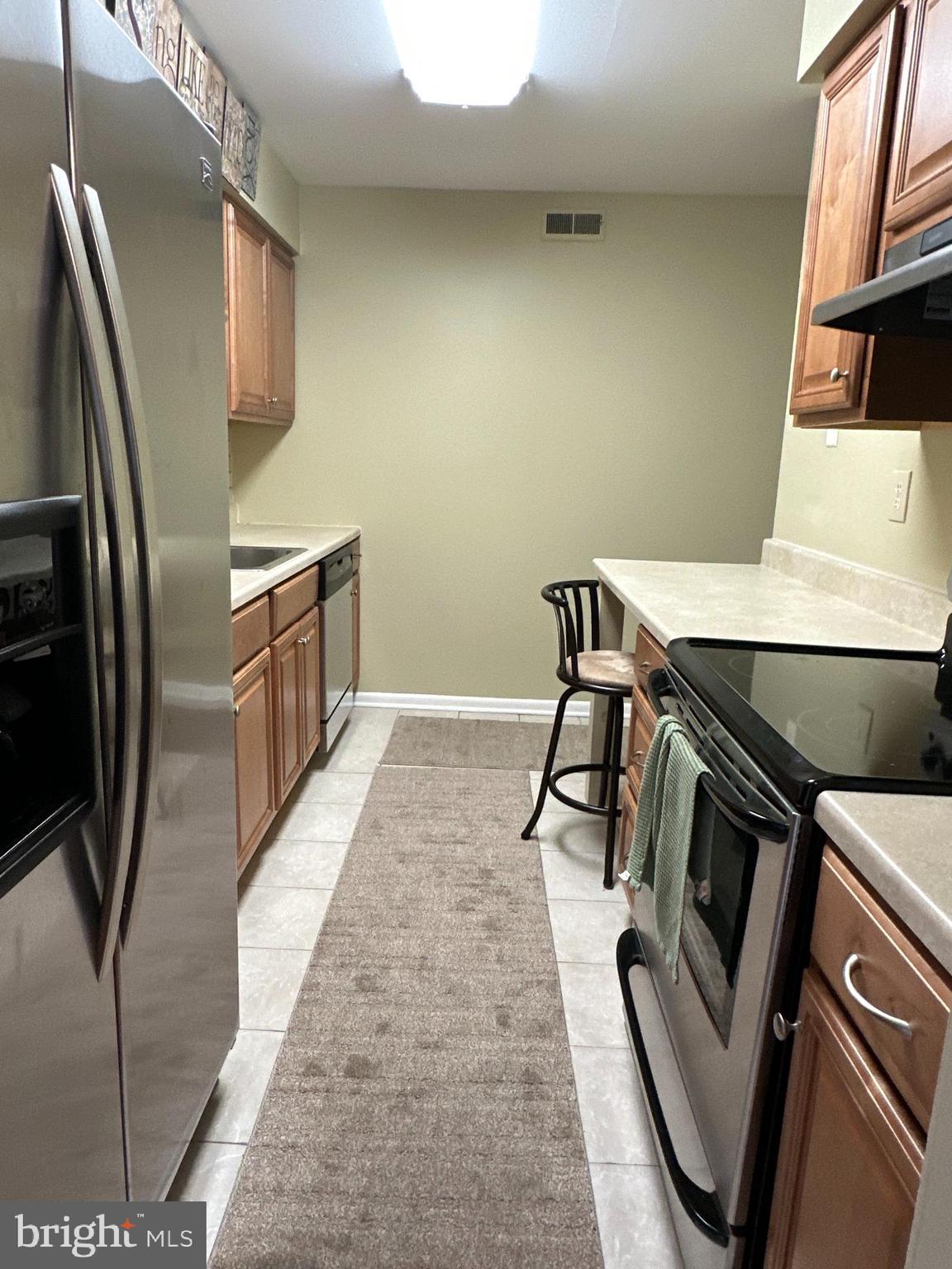 201 A Kelly Cove Mount Laurel, NJ 08054 - Photo 8 of 19 a kitchen with stainless steel appliances a refrigerator and a stove