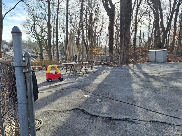 a view of street with parked cars