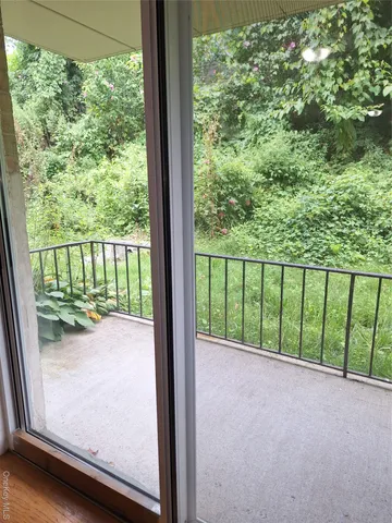 a view of a garden from a balcony