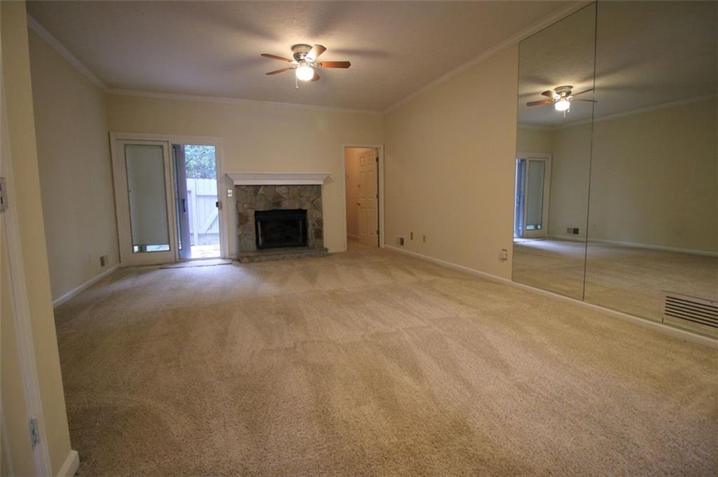 4028 Elm Street Chamblee, GA 30341 - Photo 4 of 13 a view of an empty room with a fireplace