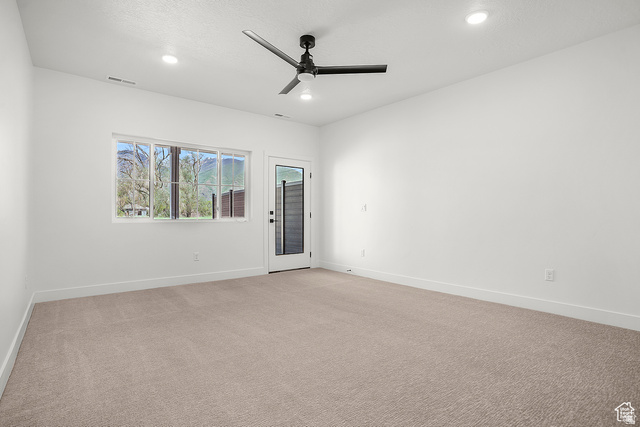 1631 West Century Lane, Unit C Mapleton, UT 84664 - Photo 17 of 31 Spacious room featuring neutral carpeting, white walls, and recessed lighting