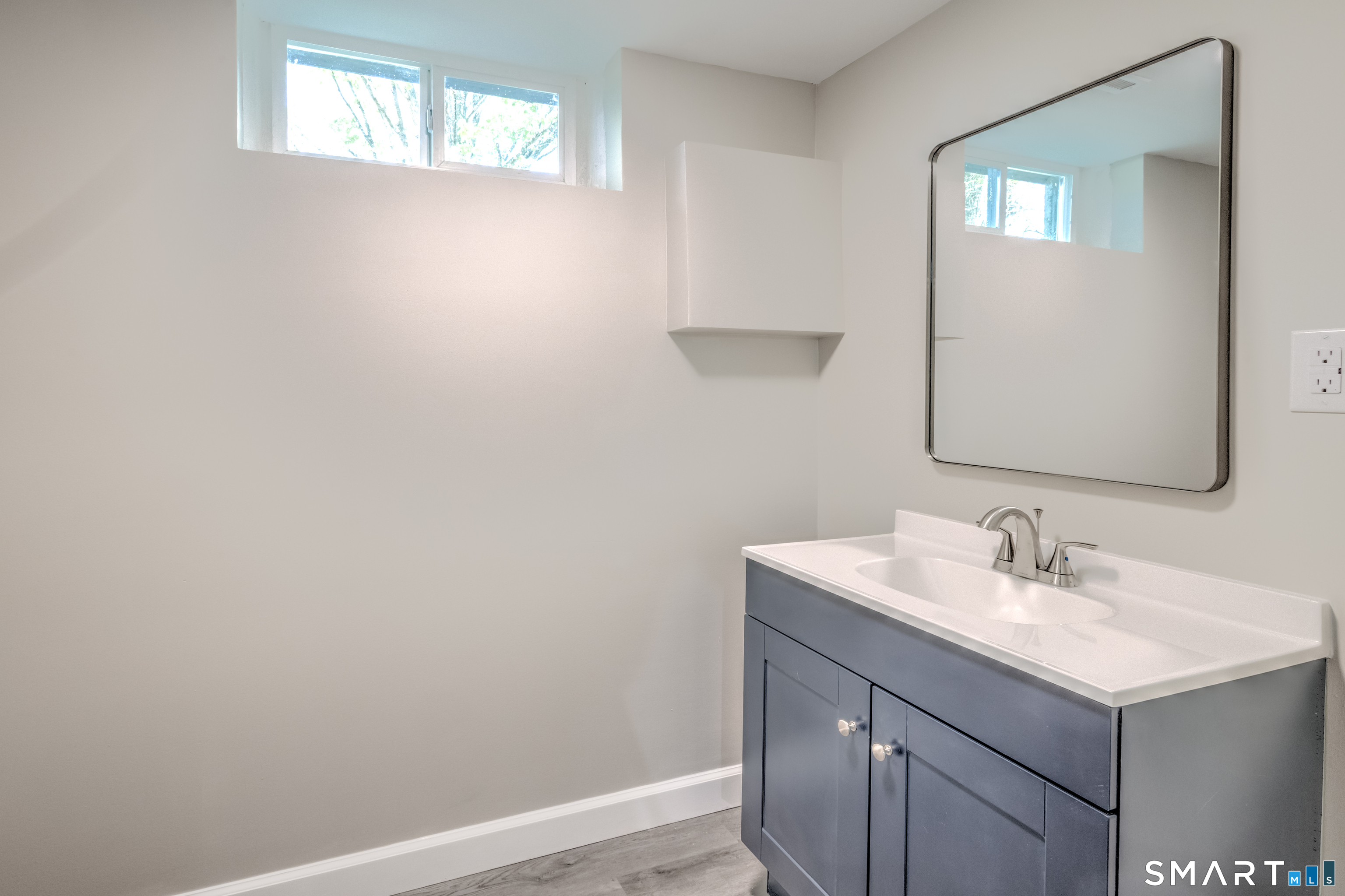 437 Middle Rd Turnpike Woodbury, CT 06798 - Photo 13 of 17 a bathroom with a sink vanity and a mirror