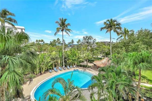 a view of a swimming pool with a yard