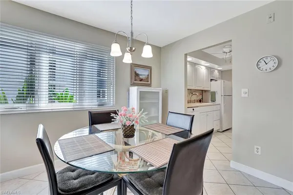 a view of a dining room with furniture and window
