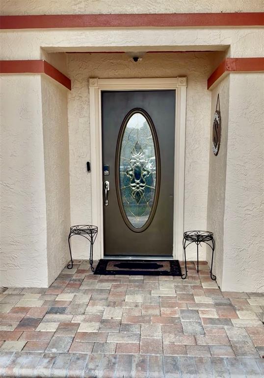 9611 Cypress Brook Road Tampa, FL 33647 - Photo 2 of 16 a view of a entryway door of a house