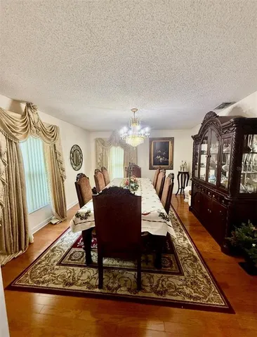 a living room with furniture a rug and a table