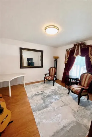 a bedroom with furniture and a window