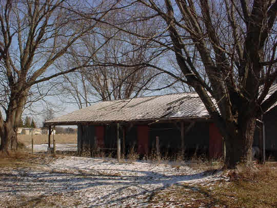 1644 Ridge Road Mt Morris, IL 61054 - Photo 2 of 8 a view of a house with a yard tree and wooden fence