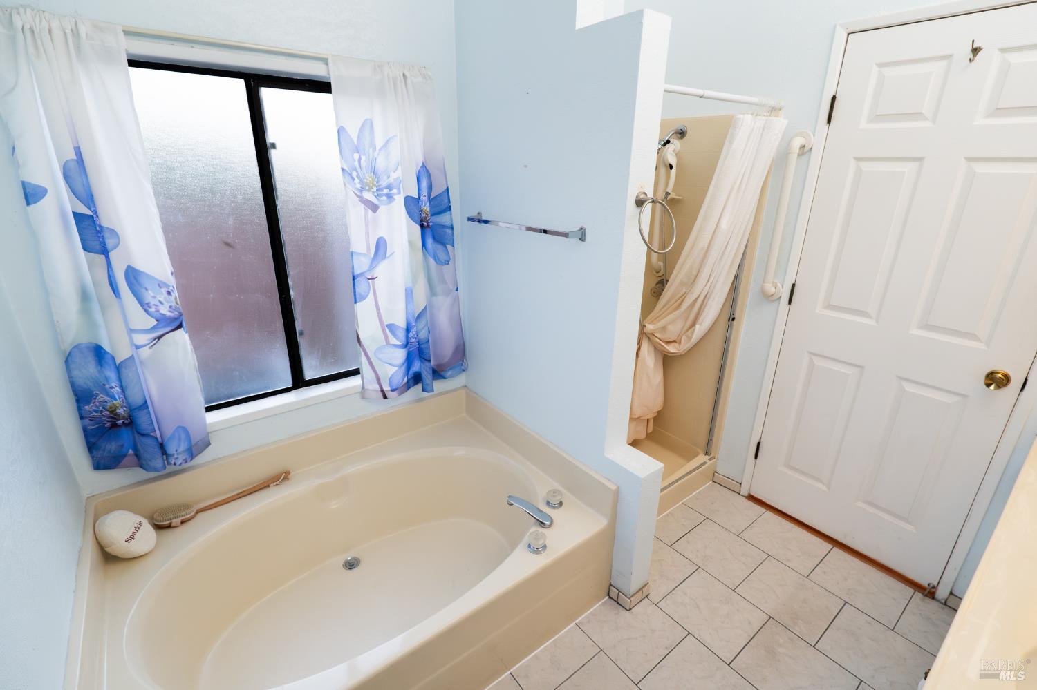 2555 Flosden Road, Unit 117 American Canyon, CA 94503 - Photo 13 of 36 a bathroom with a tub a sink and a shower