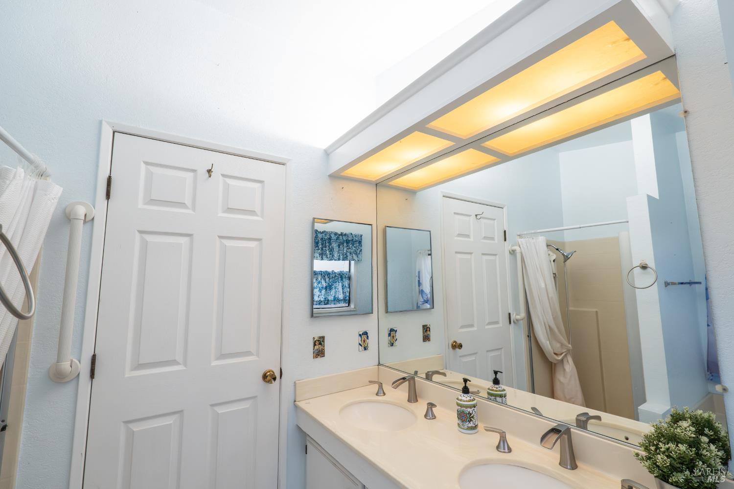 2555 Flosden Road, Unit 117 American Canyon, CA 94503 - Photo 14 of 36 a bathroom with a sink and a mirror