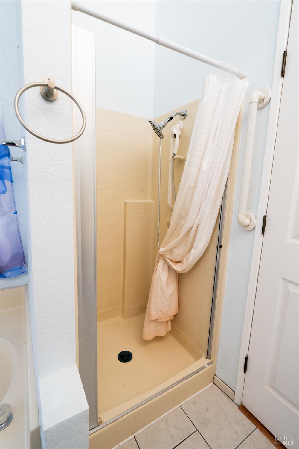 2555 Flosden Road, Unit 117 American Canyon, CA 94503 - Photo 15 of 36 a bathroom with a sink a toilet and shower