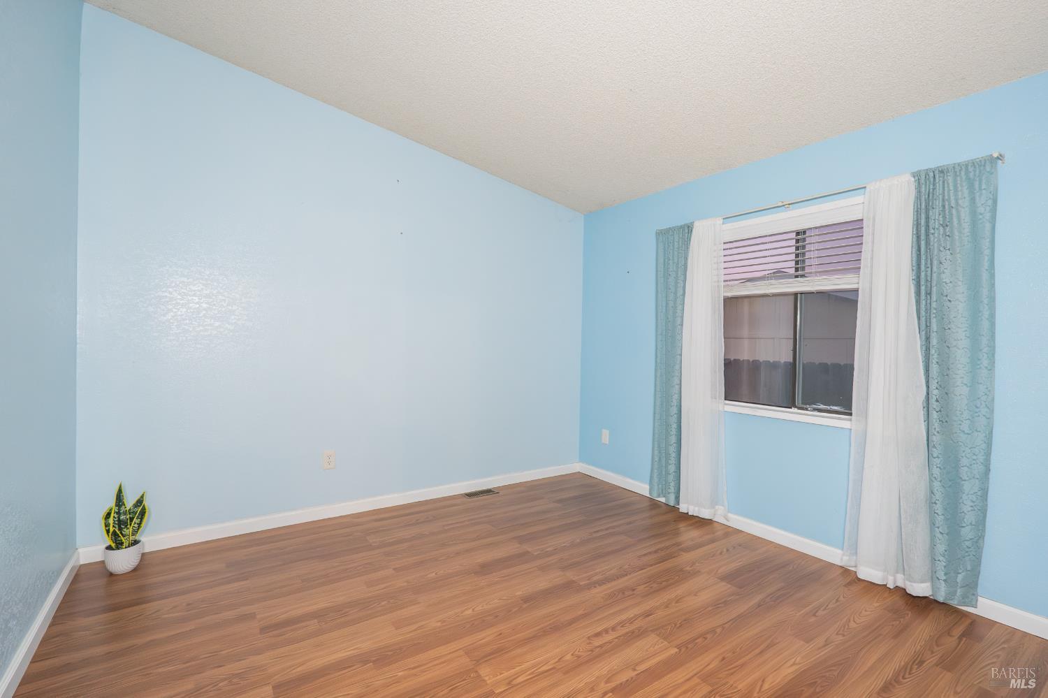 2555 Flosden Road, Unit 117 American Canyon, CA 94503 - Photo 16 of 36 a view of empty room with wooden floor