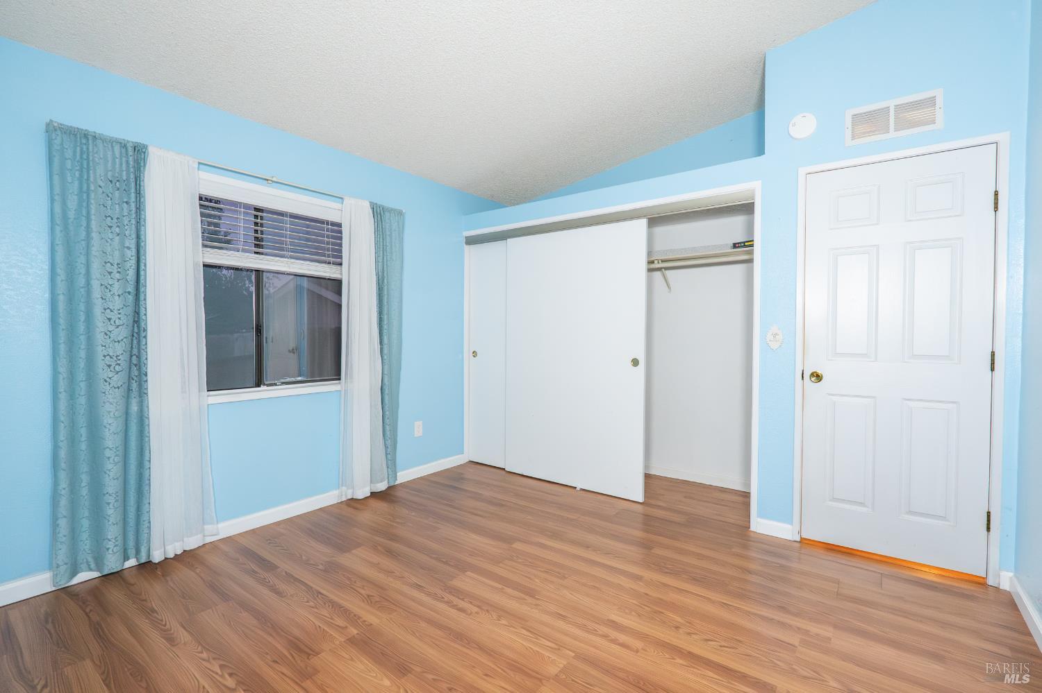 2555 Flosden Road, Unit 117 American Canyon, CA 94503 - Photo 17 of 36 a view of empty room with wooden floor