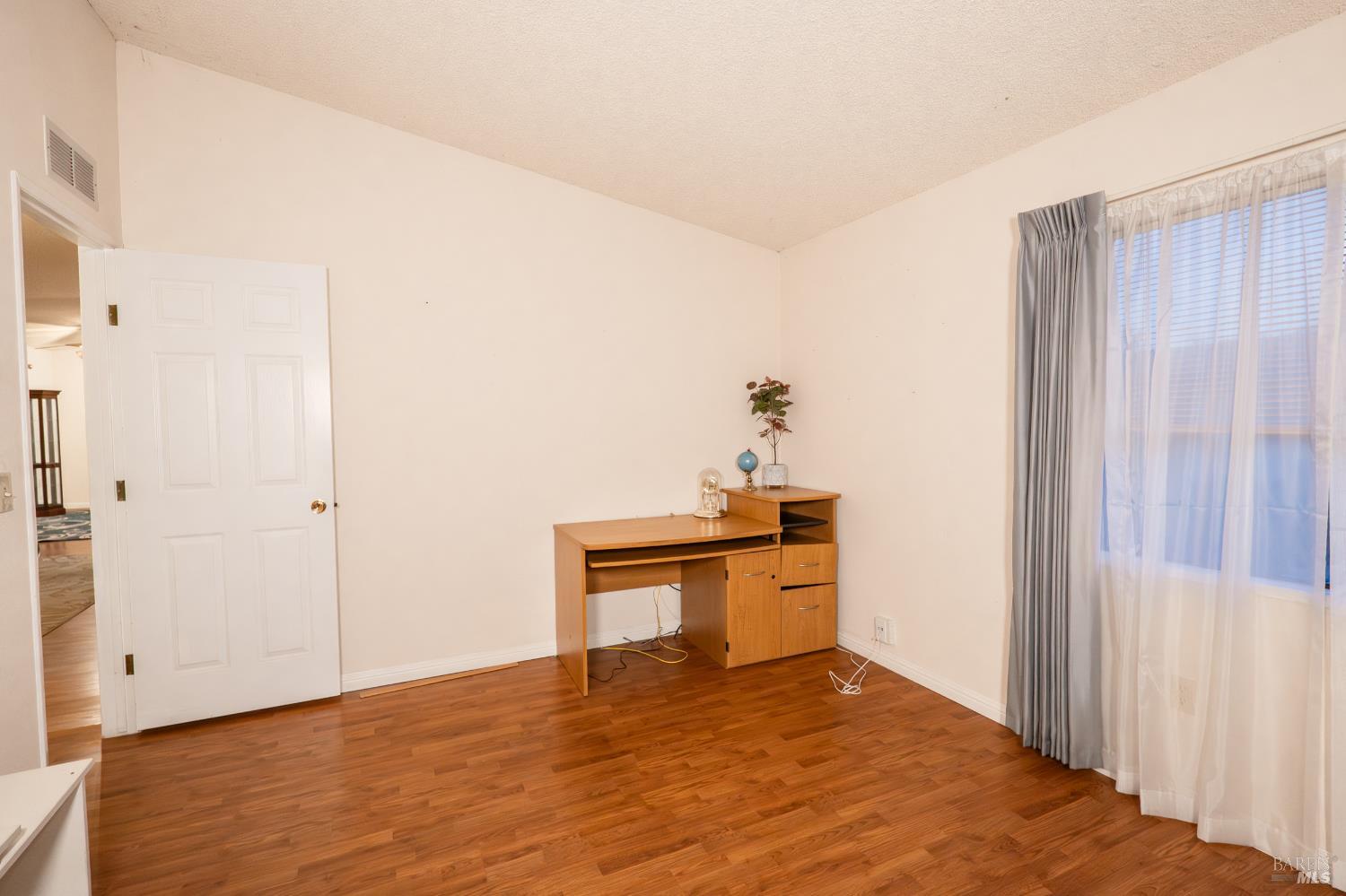 2555 Flosden Road, Unit 117 American Canyon, CA 94503 - Photo 19 of 36 a view of an empty room and window