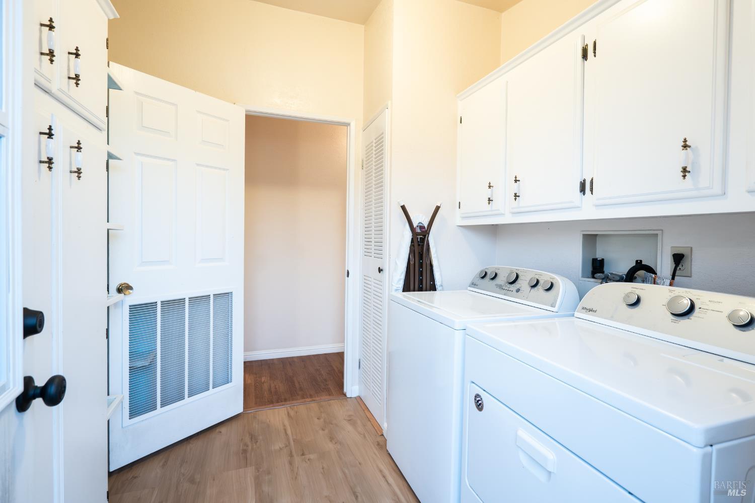 2555 Flosden Road, Unit 117 American Canyon, CA 94503 - Photo 21 of 36 a view of washer and dryer with wooden floor