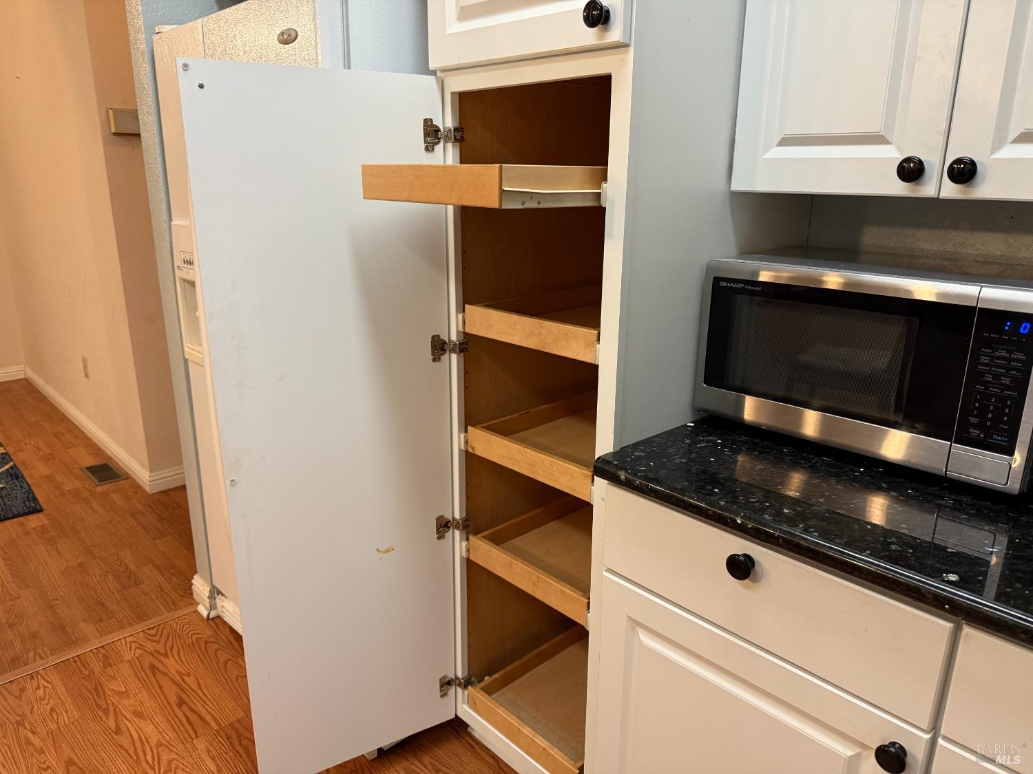 2555 Flosden Road, Unit 117 American Canyon, CA 94503 - Photo 24 of 36 a kitchen with a stove and a microwave