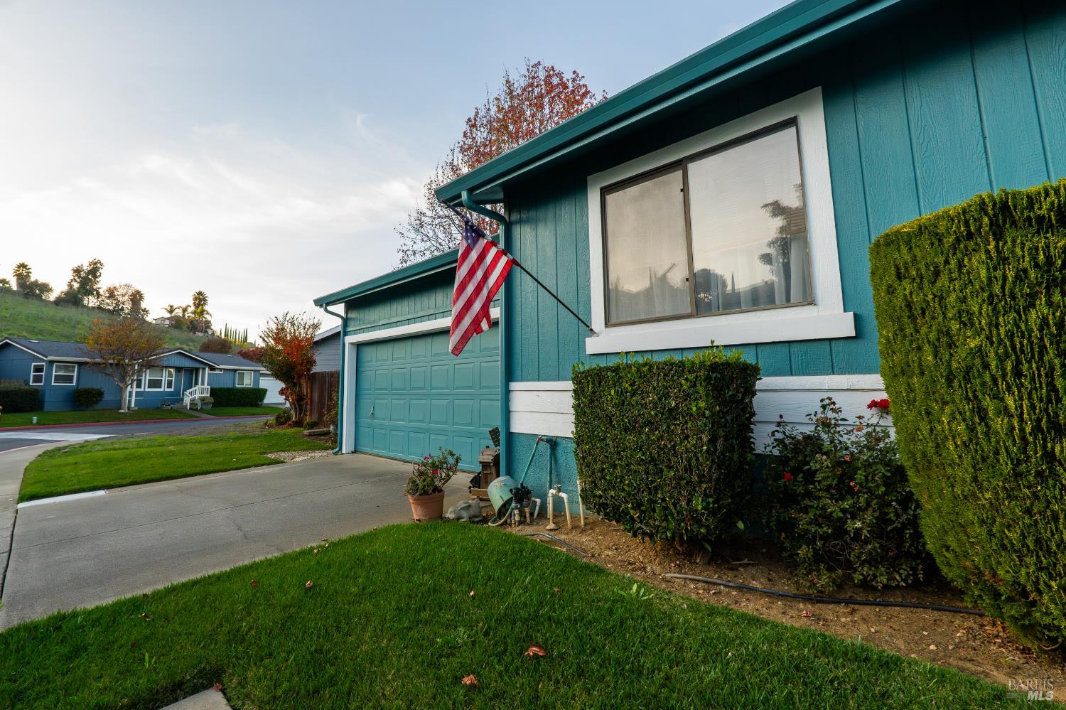 2555 Flosden Road, Unit 117 American Canyon, CA 94503 - Photo 26 of 36 a front view of a house with garden