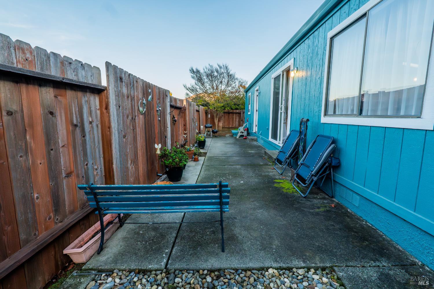 2555 Flosden Road, Unit 117 American Canyon, CA 94503 - Photo 31 of 36 a backyard with table and chairs