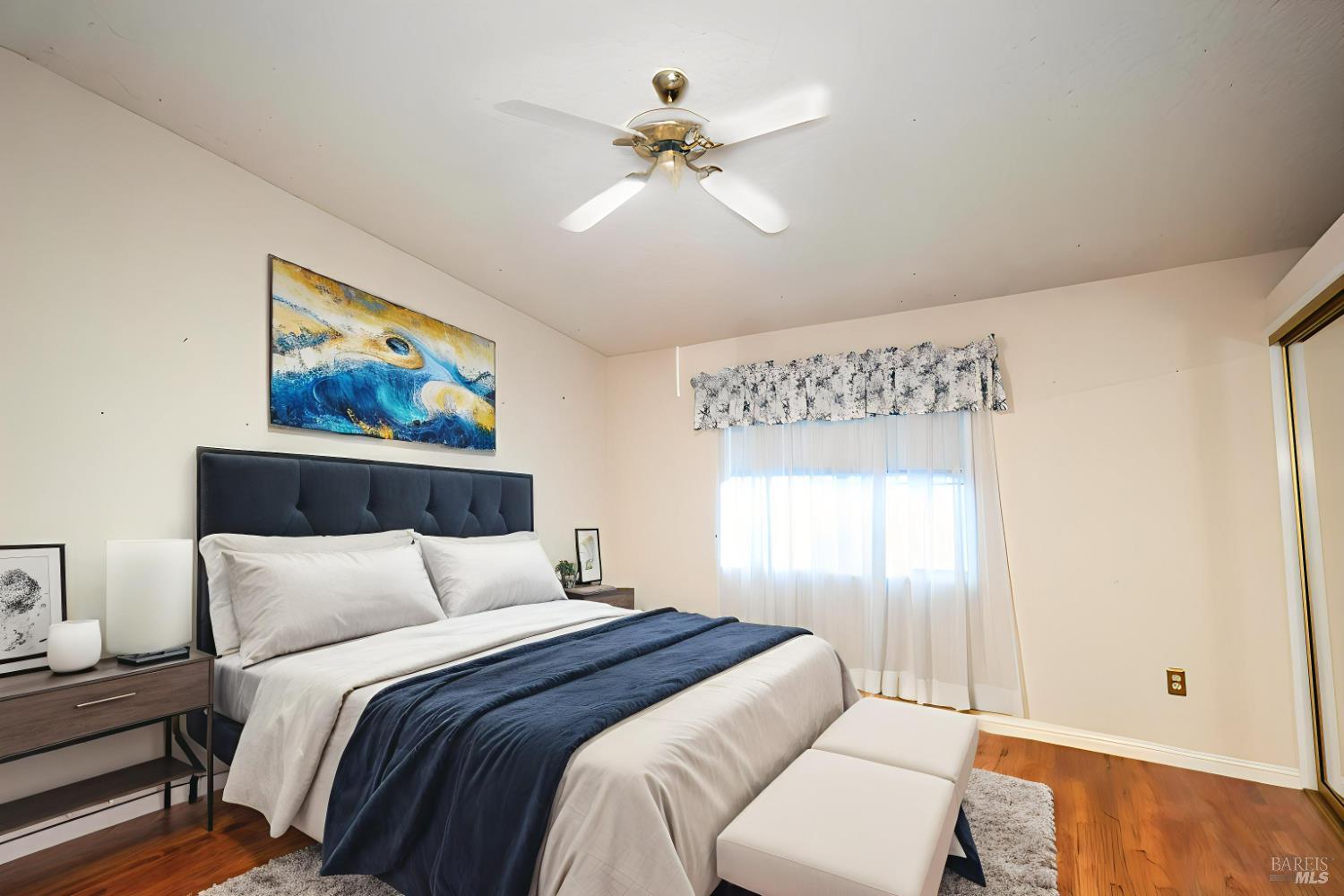 2555 Flosden Road, Unit 117 American Canyon, CA 94503 - Photo 4 of 36 a bedroom with a bed and a painting on the wall