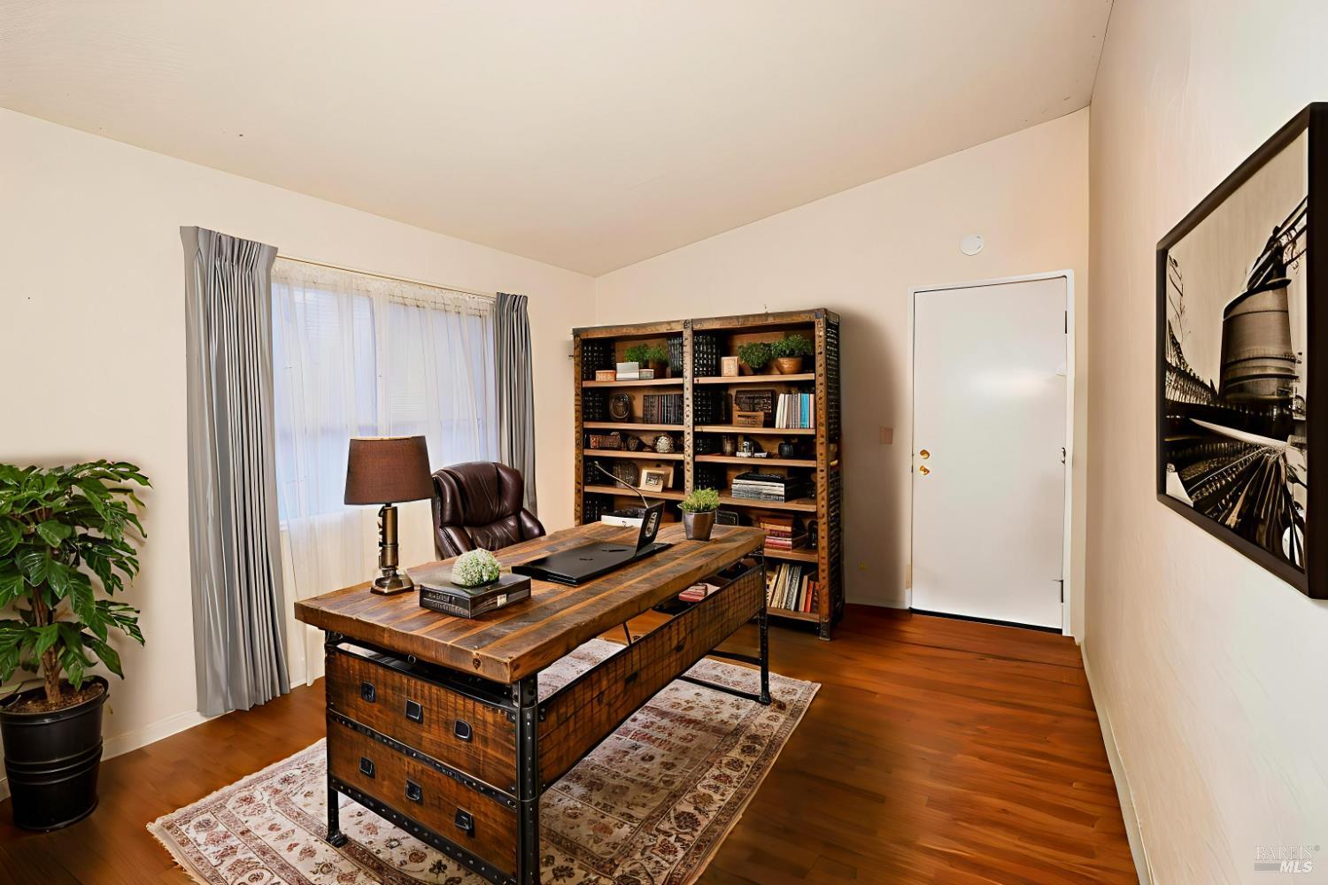 2555 Flosden Road, Unit 117 American Canyon, CA 94503 - Photo 6 of 36 a living room with furniture and a book shelf