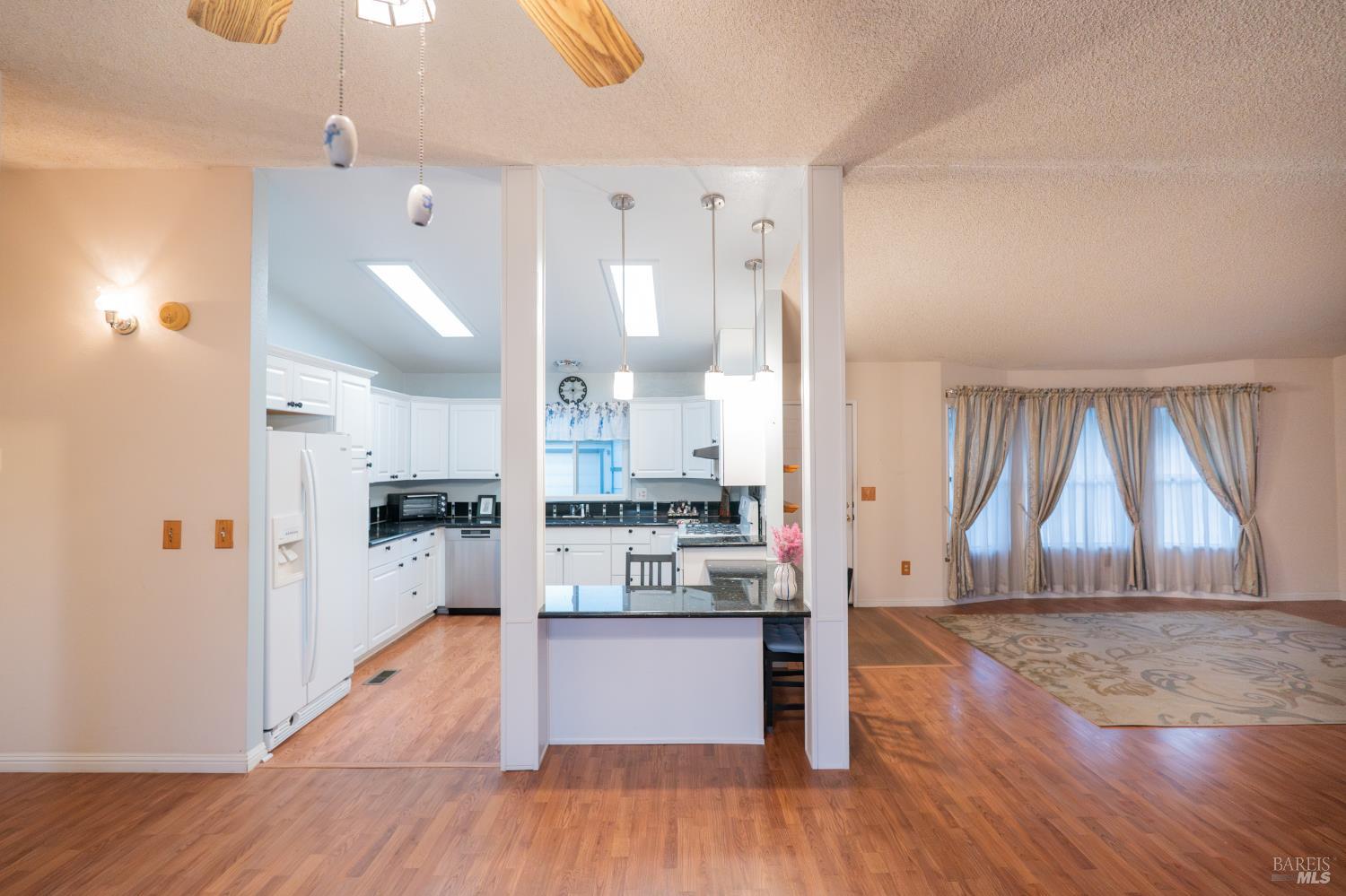 2555 Flosden Road, Unit 117 American Canyon, CA 94503 - Photo 9 of 36 a view of kitchen with wooden floor