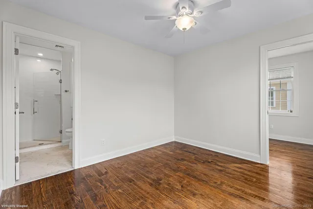 a view of a room with wooden floor and closet