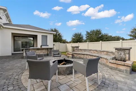 a view of a patio with a table and chairs