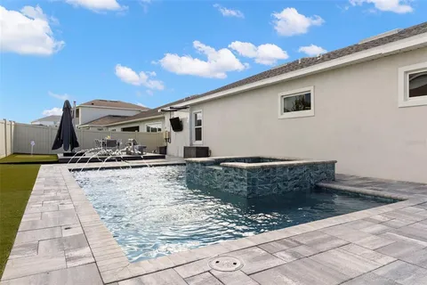 an aerial view of a house with a lake view