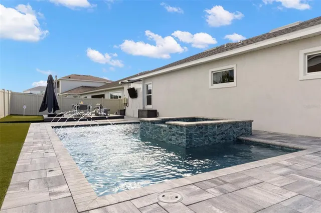 an aerial view of a house with a lake view