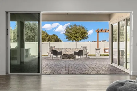 a view of living room with furniture and floor to ceiling window