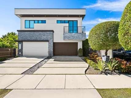 a front view of a house with a garage