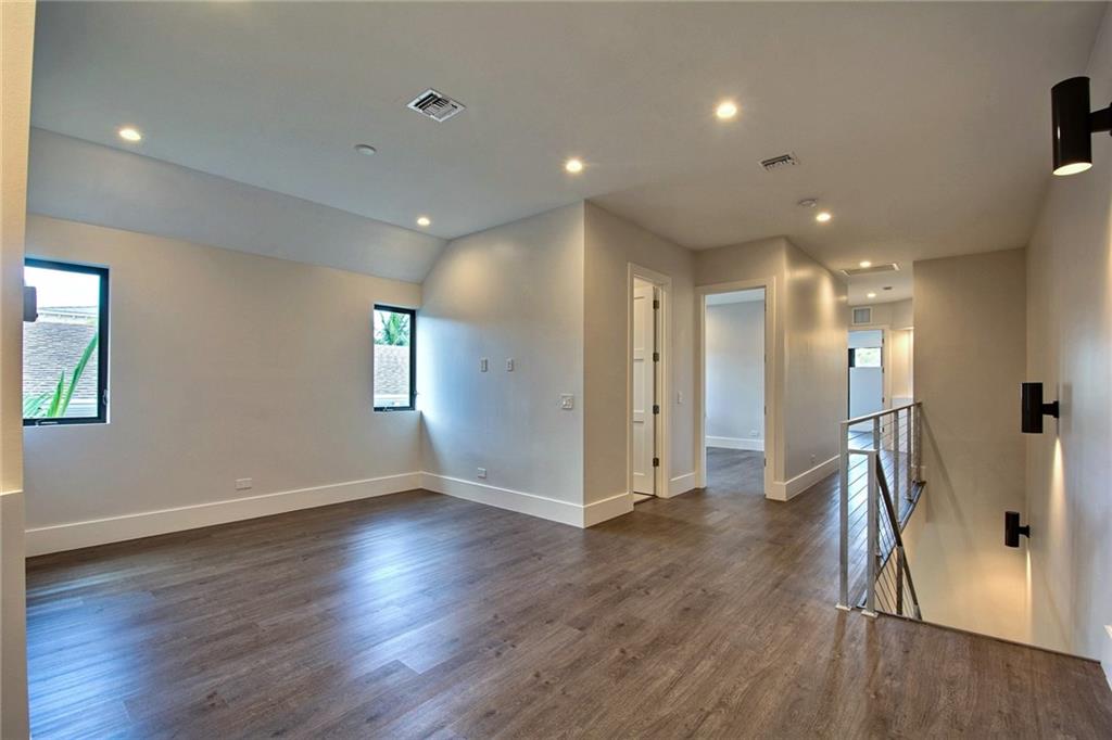 317 Northeast 15th Avenue, Unit 317 Fort Lauderdale, FL 33301 - Photo 17 of 26 a view of hallway with a window and wooden floor