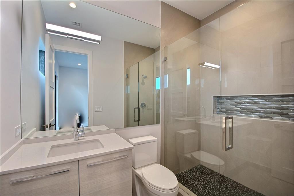 317 Northeast 15th Avenue, Unit 317 Fort Lauderdale, FL 33301 - Photo 23 of 26 a bathroom with a sink toilet and shower