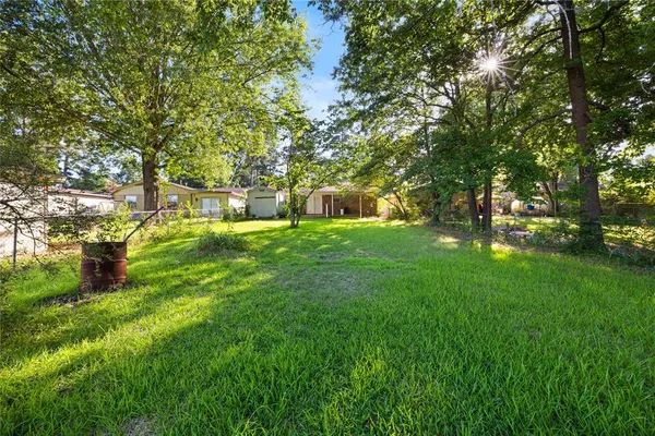 a backyard of a house with lots of green space