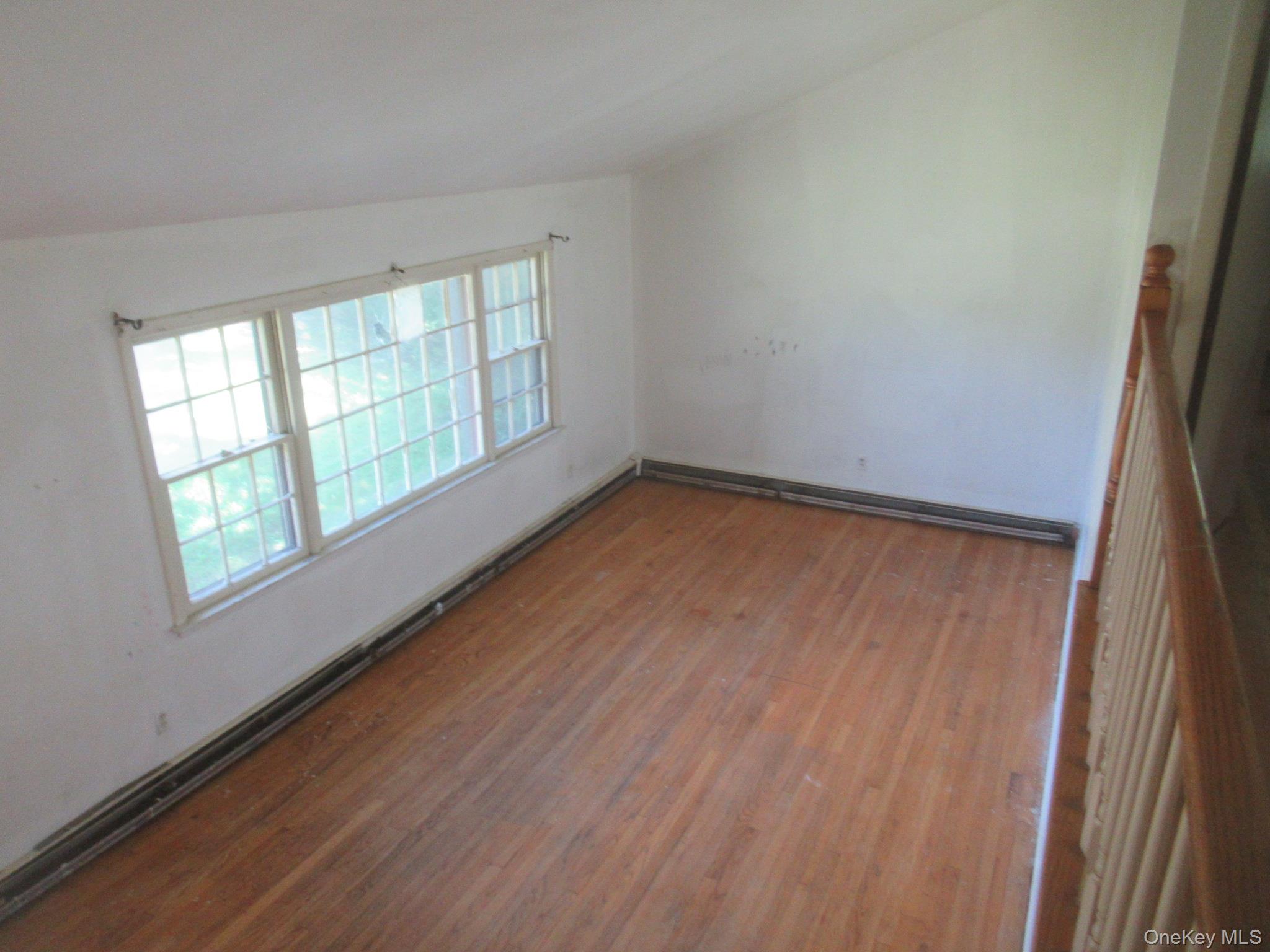 24 Edinburgh Road Middletown, NY 10941 - Photo 13 of 17 Empty room featuring wood finished floors