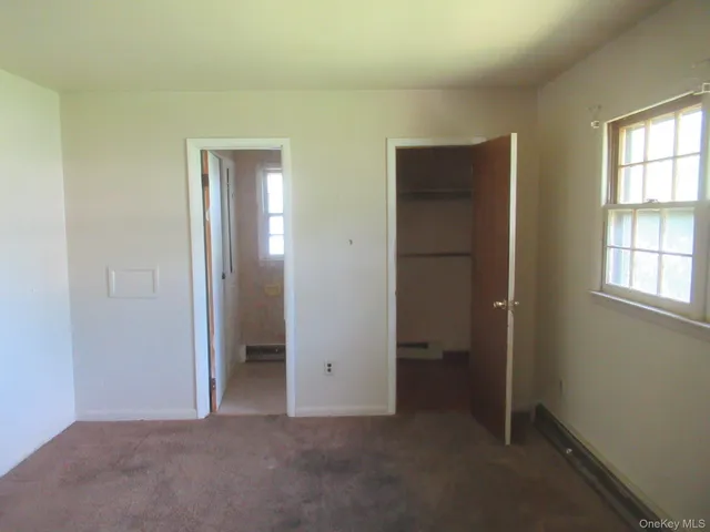 a white toilet sitting next to a bath tub