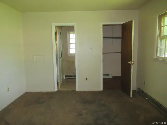 a white toilet sitting next to a bathroom sink