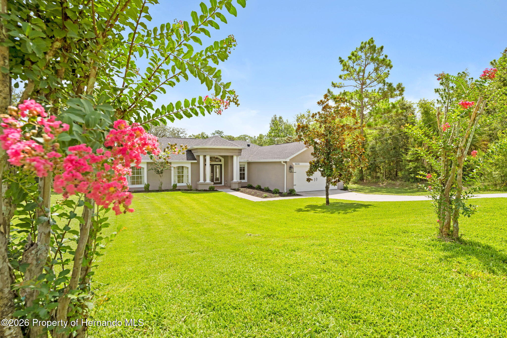 14220 Ermine Owl Road Brooksville, FL 34614 - Photo 4 of 54 a front view of a house with swimming pool