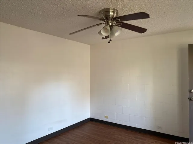 a view of a small space with wooden floor