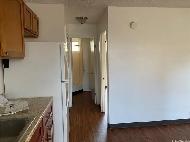 a view of a storage & utility room with wooden floor