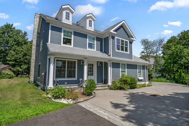 a front view of a house with garden