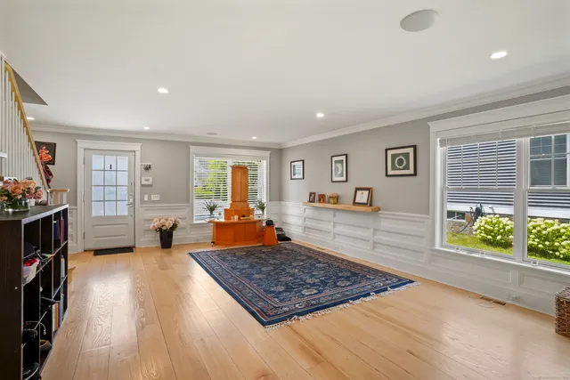 a living room with furniture rug and window