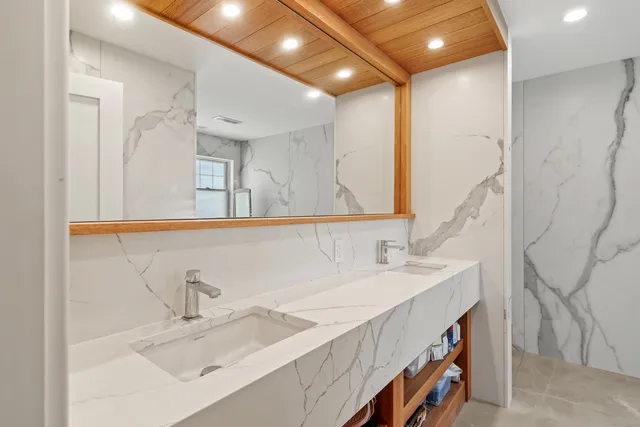 a bathroom with a glass shower door