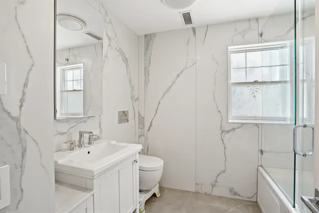 a bathroom with a bathtub and shower