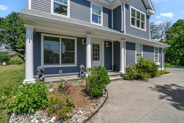 front view of a house with a yard