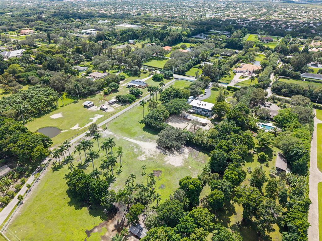 14501 Mustang Trail Southwest Ranches, FL 33330 - Photo 11 of 12 an aerial view of residential houses with outdoor space and trees