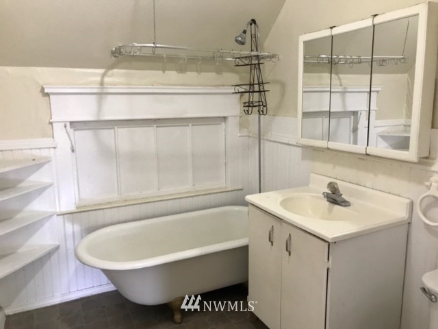 2402 Rucker Avenue Everett, WA 98201 - Photo 11 of 22 a bathroom with a bathtub and a sink