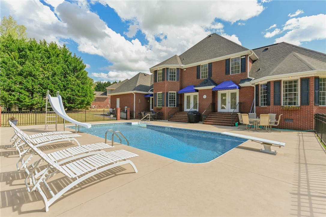 121 Caversham Lane Anderson, SC 29621 - Photo 34 of 42 HUGE 18' X 36' Pool with Diving Board and Slide