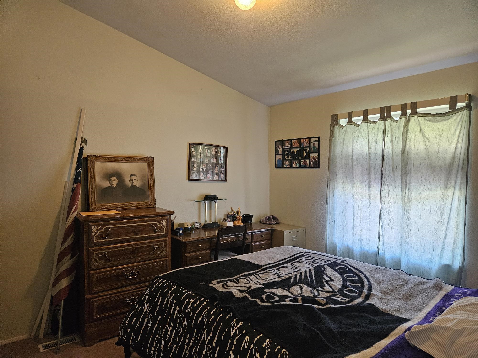 435 32 Road, Unit 424 Clifton, CO 81520 - Photo 15 of 21 a bedroom with a bed and wooden floor